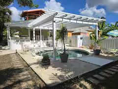 Lime Cottage Barbados — private villa with pool under a white pergola